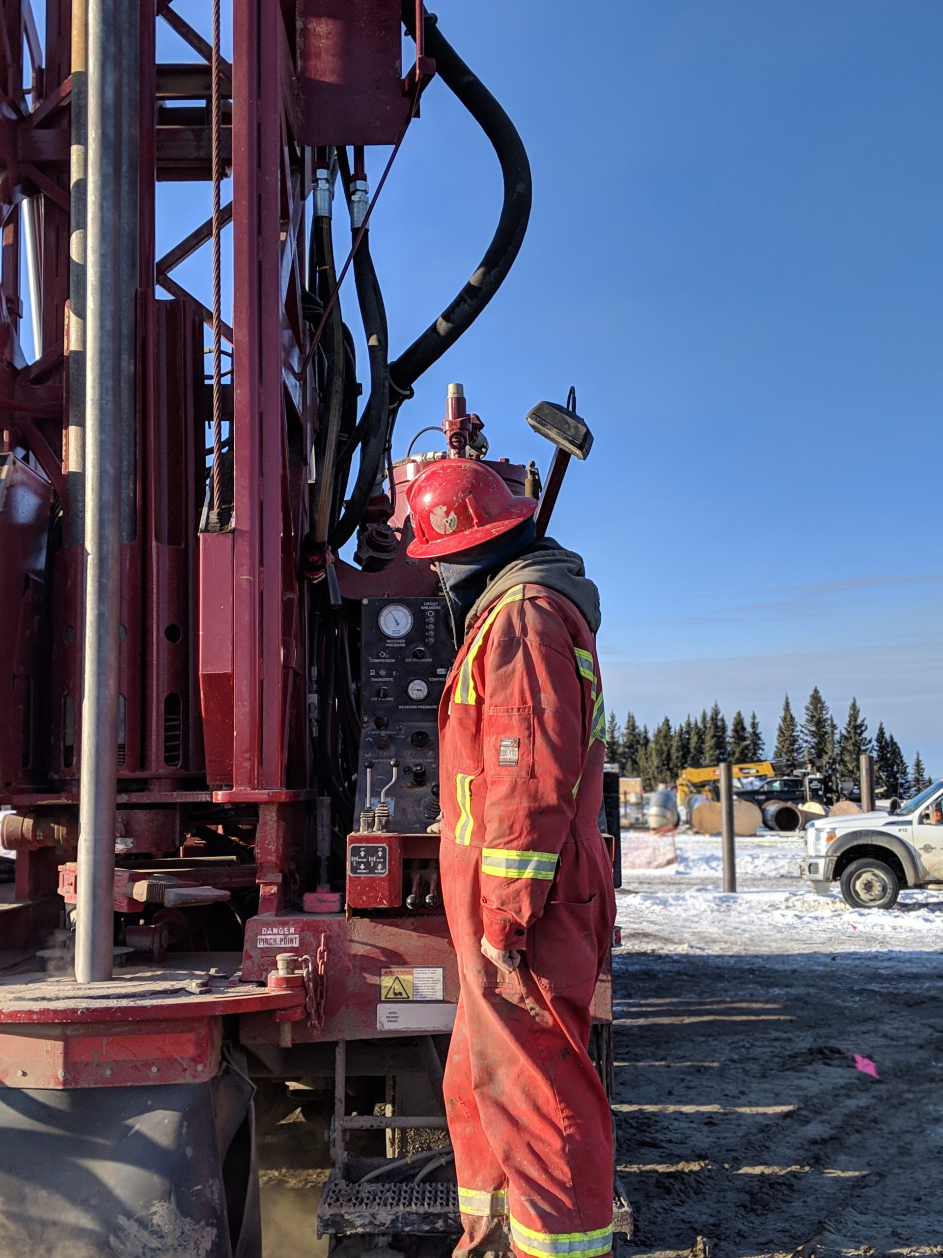 Worker inspecting drill