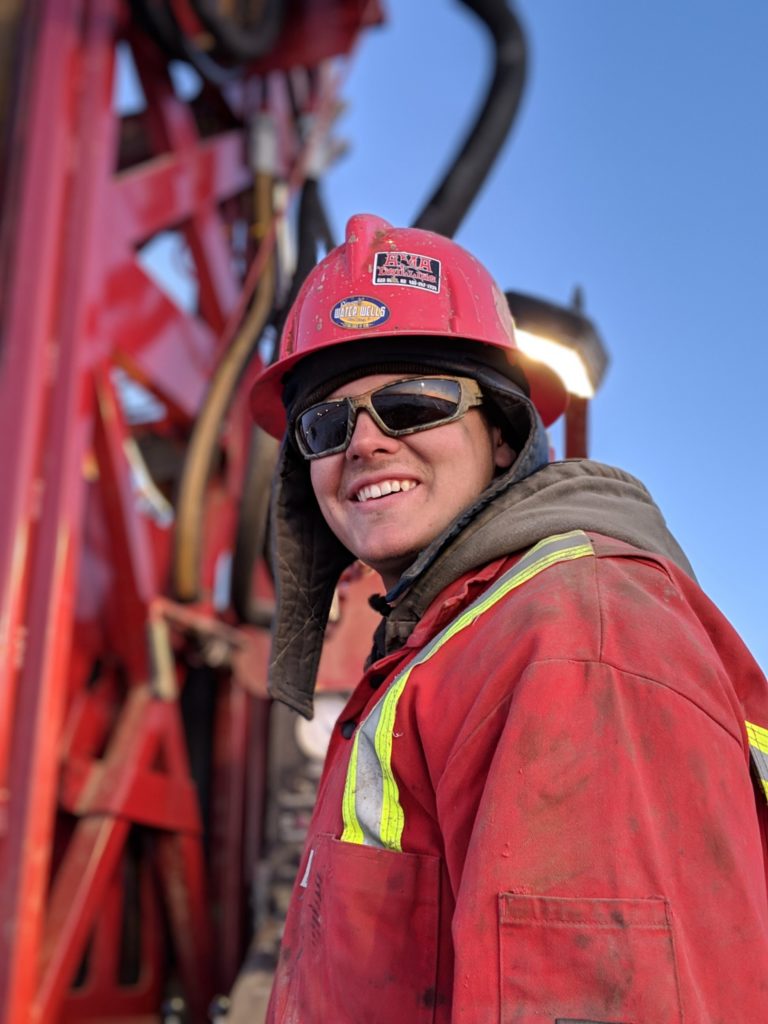 Worker portrait in front of drill